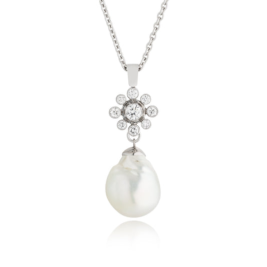 A Diamond Floral Cluster Diamond and Pearl Pendant